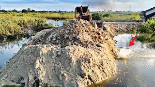 Most Specially Land Filling Operator Nearly Connecting To Other Size, Dozer Pushes Dirt Making Dike