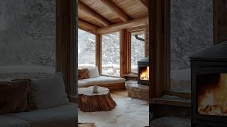 Snowy retreat: wood stove, cozy seating, and mountain views.