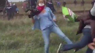 Hungarian camerawoman trips migrants