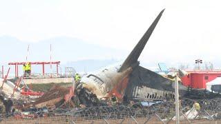 Recovery teams work on site of Jeju Air plane crash that kills 179 | AFP