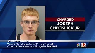 Virginia man accused of driving into crowd of protesters, according to police