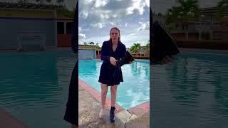 jump in water wearing skirt, sweater and boots