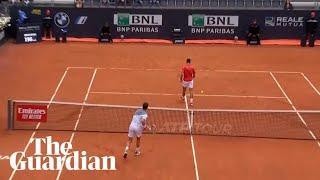 Cameron Norrie smashes ball into Novak Djokovic's legs as world No 1 turns back on net