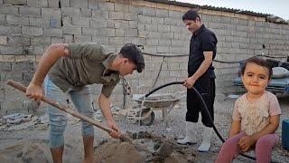 Teamwork: Mehran and Mehdi Cement the Porch Foundation