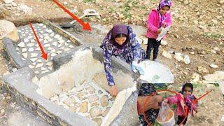 Water and life.  Completion of water pond project by a mother and orphan girl,