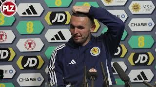 John McGinn reacts to Aston Villa being drawn against Celtic in the Champions League.