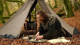 Bushcraft trip - windy day in a canvas tent, cooking on a wood stove, homemade axe and knife etc.