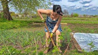 My wife takes care of the garden and the house in beautiful dresses. Life in the village on the farm