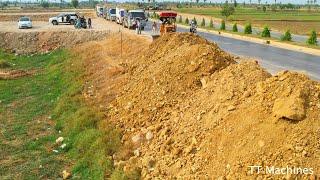 First Opening New Project Fill In The Slope Near High Way Road By Dump Trucks & Bulldozer Push Stone