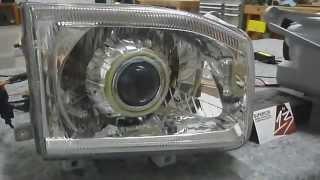 Nissan Pathfinder Projector Retrofit w/Halos & HIDs by 13