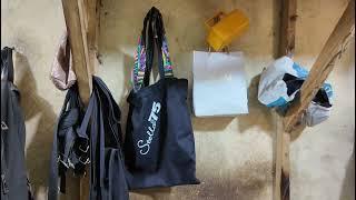 Mr. Muri cuts and sew bag in Mushin Leather Market Lagos