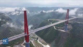 New towering bridge opens to traffic in China's mountainous Guizhou Province