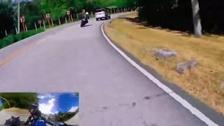 Minivan uses gutter run to try and keep up with motorcycles