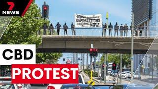 13 men reported over Adelaide CBD neo-Nazi bridge protest | 7NEWS