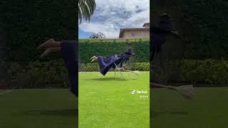Ciara doing the defying gravity chair challenge dressed as Elphaba
