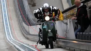 Scooter stuntman hill climbing with Vespa Guenter Schachermayr