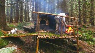 bushcraft natural shelter ,making mud bricks  ,log walls ,winter time in ireland