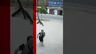 Girl rescues sister from runaway vehicle in China | BBC News