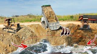 The highly skilled Komatsu dozer excels pushing dirt despite encountering significant sinking issues