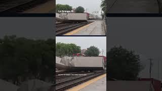 Freight train and semitruck collide at suburban rail crossing