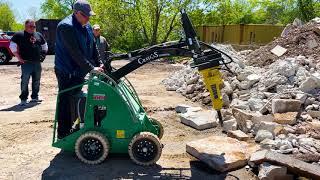 The Sherpa 100ECO with a Hydraulic Hammer Attachment Breaking Concrete