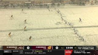 college football is being played in a snowstorm 