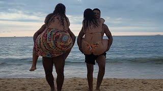 Strong Men Lifting Up Girls on the Beach