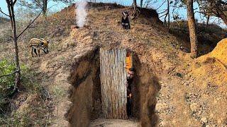 Building a warm and cozy dugout for survival. Warm stove and heated bed. Bushcraft.