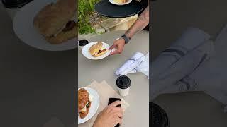 Wake up to a mouth-watering croissant sandwich, freshly baked cinnamon roll, and perfectly Americano