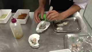 Philippe Favié prepares a starter with oyster at the Michelin star Latour