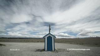 Clouds moving above a small mail-drop building BS0543