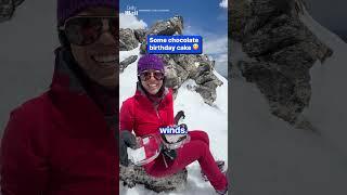 Climber surprised with birthday cake at top of summit