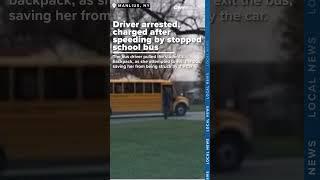 Driver arrested, charged after speeding by stopped school bus