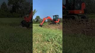 Ditch digging with the KX040 and a tilt bucket