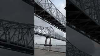 Mississippi River bridges reflected on a building in New Orleans #neworleans #portofneworleans