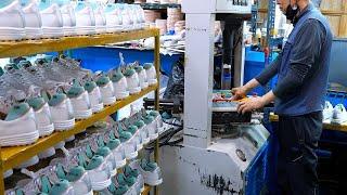 process of making golf shoes. An old shoe factory in Korea.