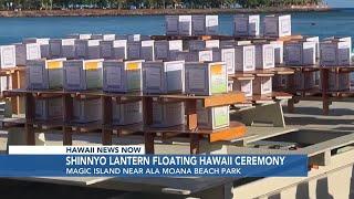 Crowd gathers for lantern floating ceremony at Magic Island