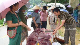 Robert sells wild boar meat at the market. Green forest life