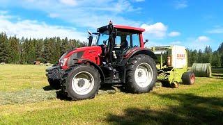 Valtra N123 H5 making hay bales with a Claas Rollant 46 Rc