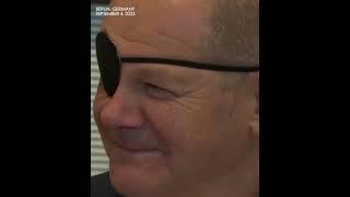 German Chancellor 'Pirate Olaf' Scholz appears at Congress wearing eyepatch after jogging accident