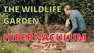 Hibernaculum for garden wildlife. Log Pile, Bug Hotel