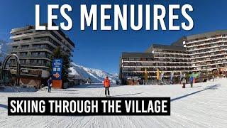 Skiing through Les Menuires village in Les 3 Vallees