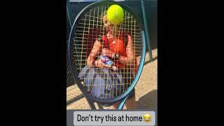 Catches the ball and in insect inside her strings!