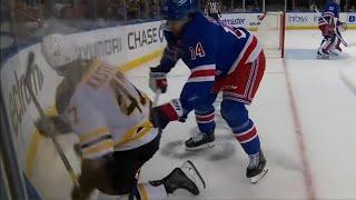 Mark Kastelic Challenges Connor Mackey After Hit Along Boards