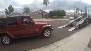 Car's  being loaded on transport for our move to Florida from Arizona