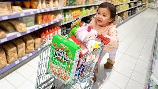 Grocery shopping with a TiNY shopping CART - Anything you can fit dad will buy!