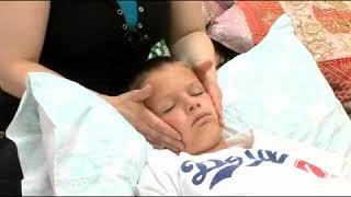 Massaging Cheeks of Child to Treat Sinus Congestion