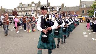 Scotland the Brave as Dunnottar Pipes and Drums march off via bar at 2024 Stonehaven Feein' market