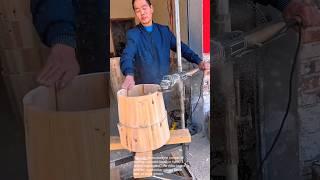 Master craftsman shapes a wooden barrel: amazing skill!