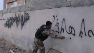 NPU - erasing ISIS graffiti - Baghdedeh